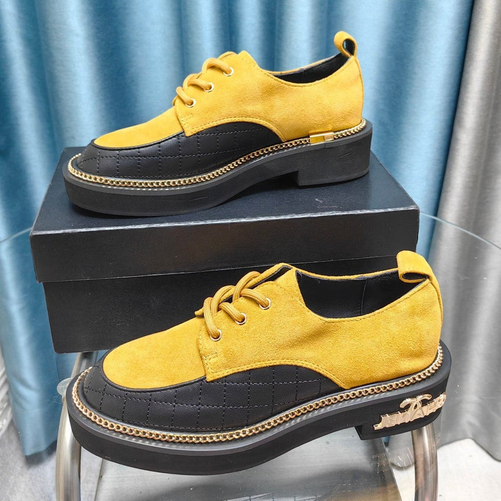 CHANEL OXFORD SHOES IN GOLD YELLOW SUEDE AND BLACK SHEEPSKIN