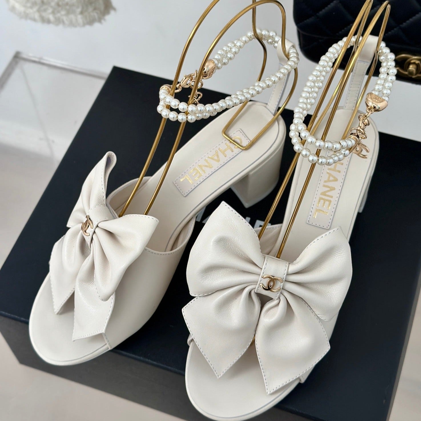 CHANEL Double C Big Bow Pearl Chain High Sandals White Lambskin
